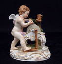 Meissen porcelain figurine of cupid sharpening his