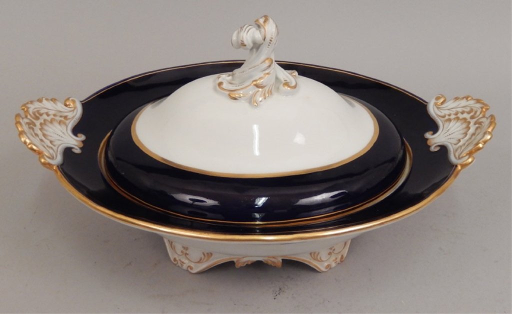 Meissen covered serving bowl: Meissen covered serving bowl, cobalt with gilt rims, foliate handles and finial, blue underglaze crossed swords mark on bottom, 6 3/4" high x 13 1/8" across
