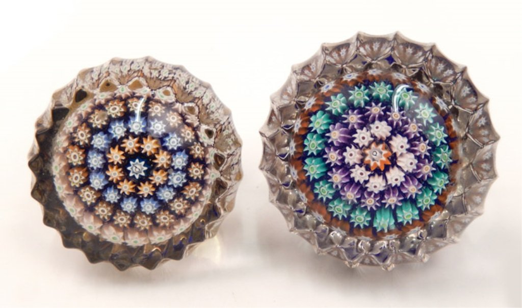Two Perthshire millefiori door knobs: Two Perthshire millefiori art glass door knobs, centric millefiori design, center signature P cane surrounded by four rings of canes, one knob's ring colors are white, purple, green, and orange, other