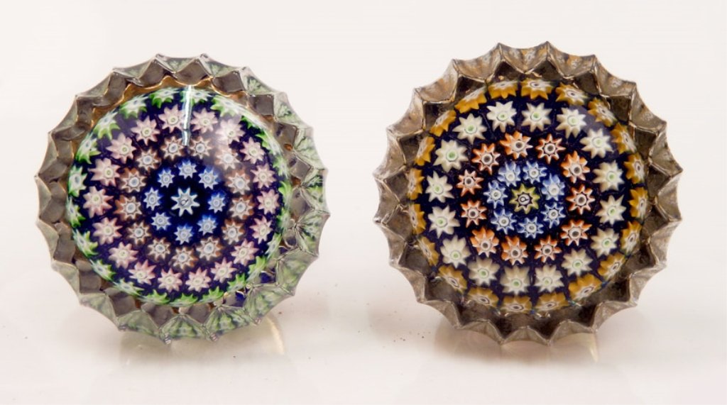 Two Perthshire millefiori door knobs: Two Perthshire millefiori art glass door knobs, centric millefiori design, center signature P cane surrounded by four rings of canes, one knob's ring colors are blue, orange, pink, and green, other kn