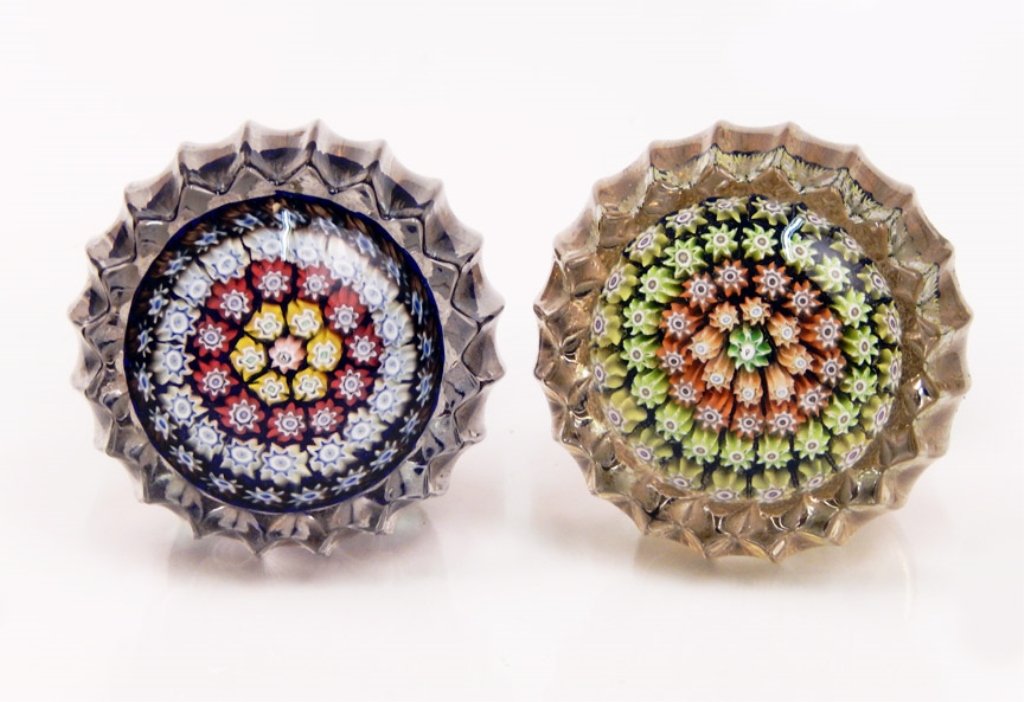 Two Perthshire millefiori door knobs: Two Perthshire millefiori art glass door knobs, centric millefiori design, center signature P cane surrounded by four rings of canes, one knob's ring colors are yellow, red, light blue, and brown, oth