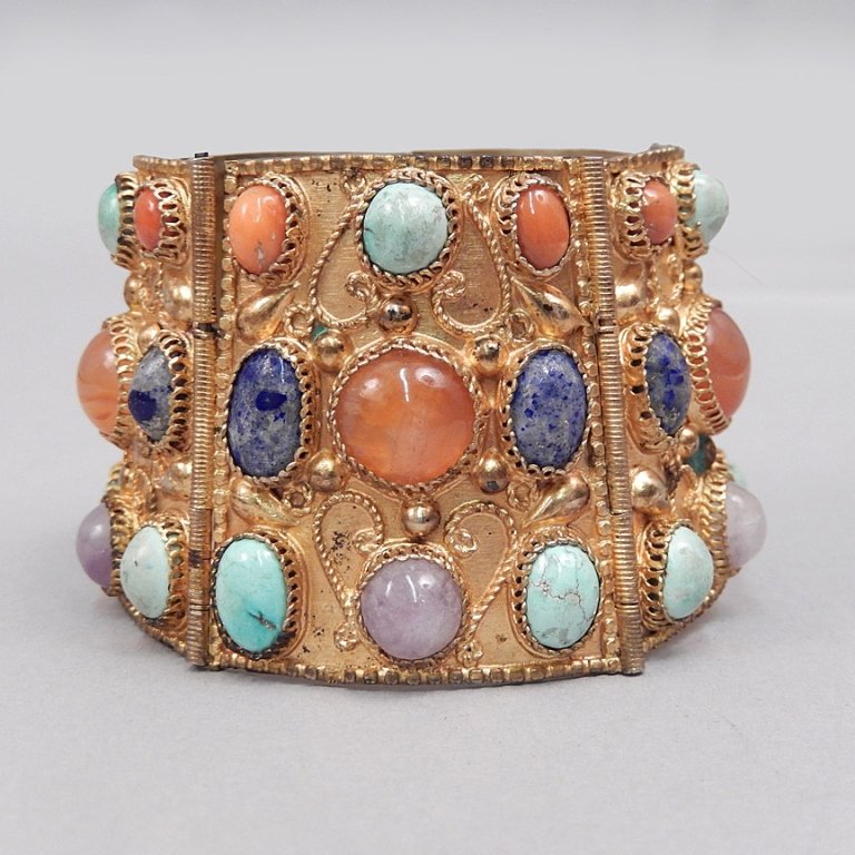 Gilt sterling silver gemstone bracelet: Gilt silver hinged panel bracelet with turquoise, coral, lapis, amethyst and chalcedony cabochons, measures approximately 7" x 1 3/4" with pin clasp, unmarked, tests silver, weighs 2.49 ozt complete,