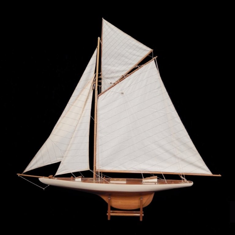 Large wooden sailboat model: Large wooden sailboat model, linen sails, painted white and red border, on stand, 45" high x 47 1/2" across x 6 3/4" deep, on stand 46" high