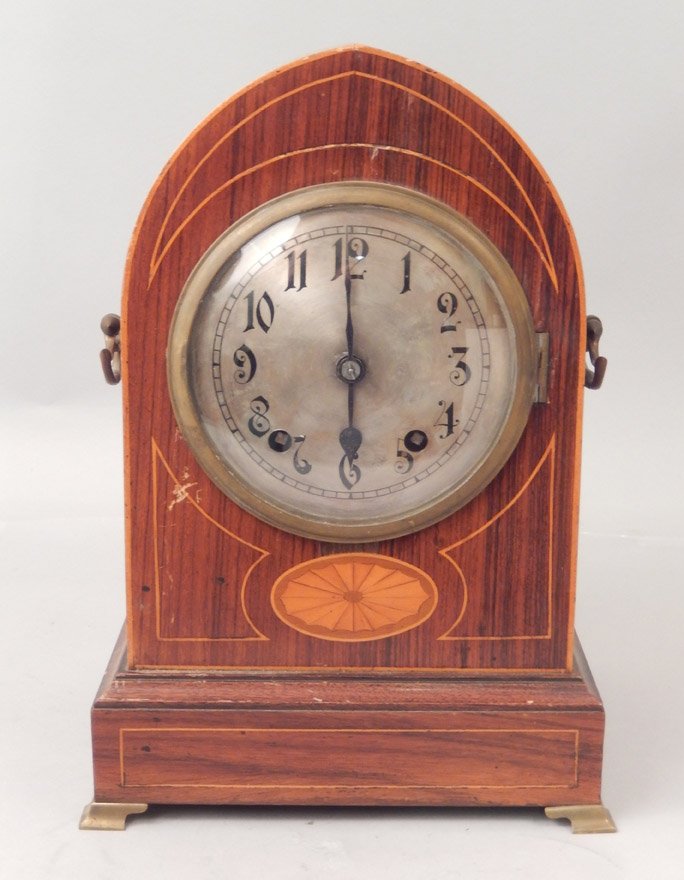Winterhalder and Hofmeier inlaid black walnut clock: Winterhalder and Hofmeier inlaid black walnut cased clock, metal face, brass bracket feet, and brass handles, before 1933, with key and pendulum, 13 1/4" high x 8 3/4" x 7"