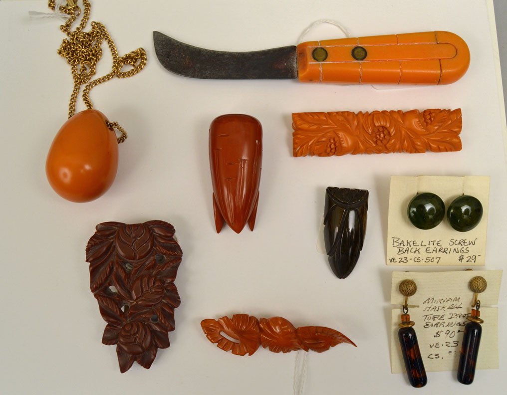 Grouping of bakelite jewelry and accessories: Grouping of bakelite jewelry and accessories, nine pieces, includes pair of Miriam Haskell dangle earrings, tube drop, screw back, marked, 2", pair of green bakelite screw back button earrings, 3/4",
