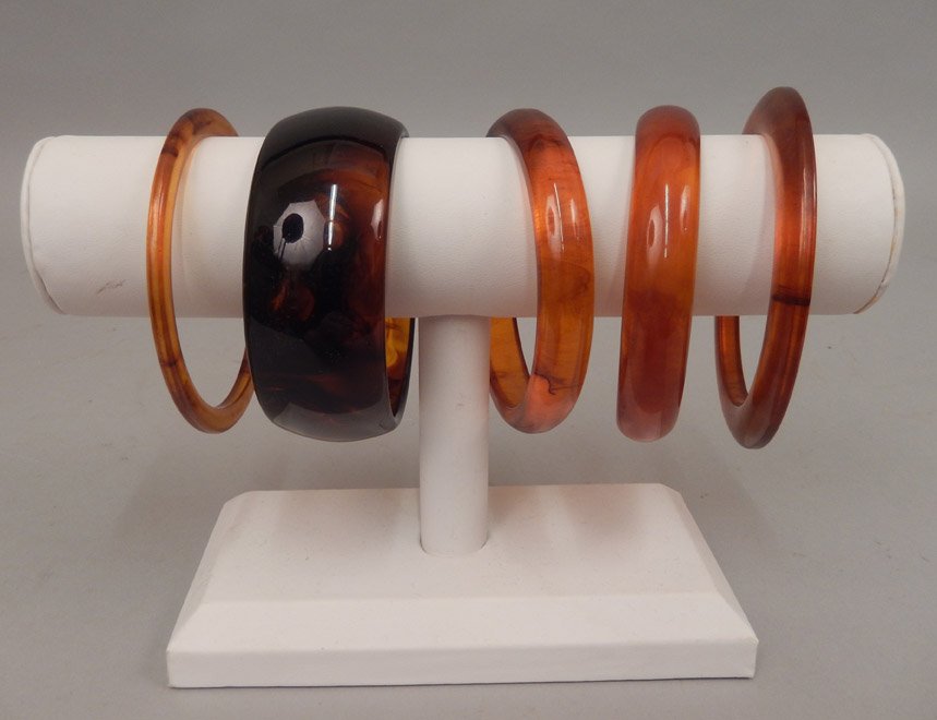 Five bakelite bangles: Five bakelite bangles, four root beer bakelite, and one apple juice bakelite