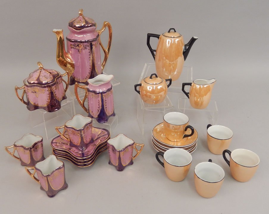 Two demitasse tea sets: Two demitasse tea sets, one set shades of pink and purple with gilt decoration, marked on bottom "J B & W, NY, Germany", teapot, 7 1/2", creamer 4 1/4", sugar bowl, 4 1/4", four cups, 2 1/4", and four