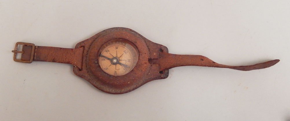 German military wrist compass: German military wrist compass, leather band and casing, marked on face Made in Germany, leather interior marked Ingersoll