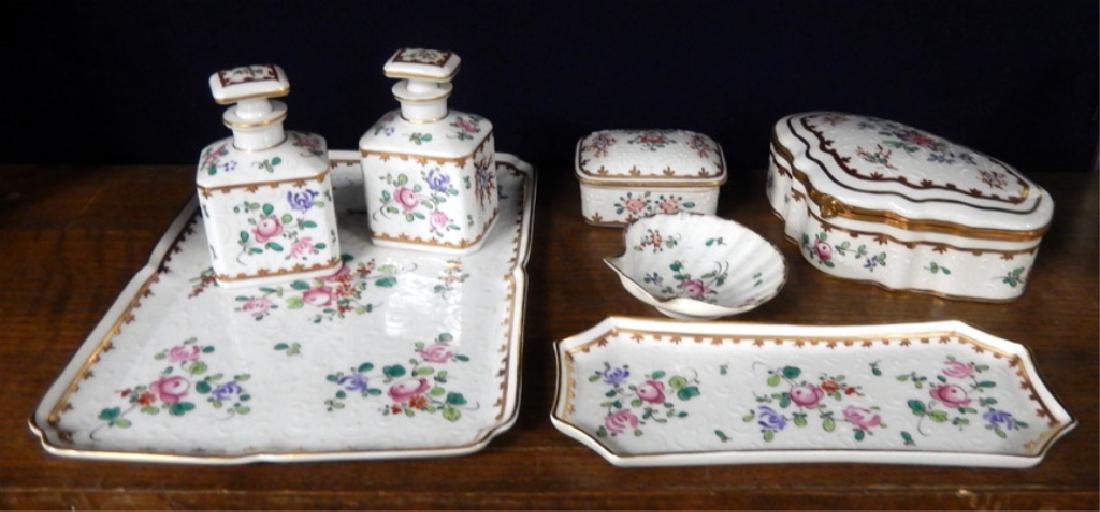 Hand painted Limoges dresser set: Hand painted Limoges dresser set, seven pieces, includes a pair of lidded perfumes 4 1/2" high, pin tray 9 1/4", clamshell dish, covered box, tray 11 1/2" x 8 1/2", and jewel box with hinged lid 2 1/2