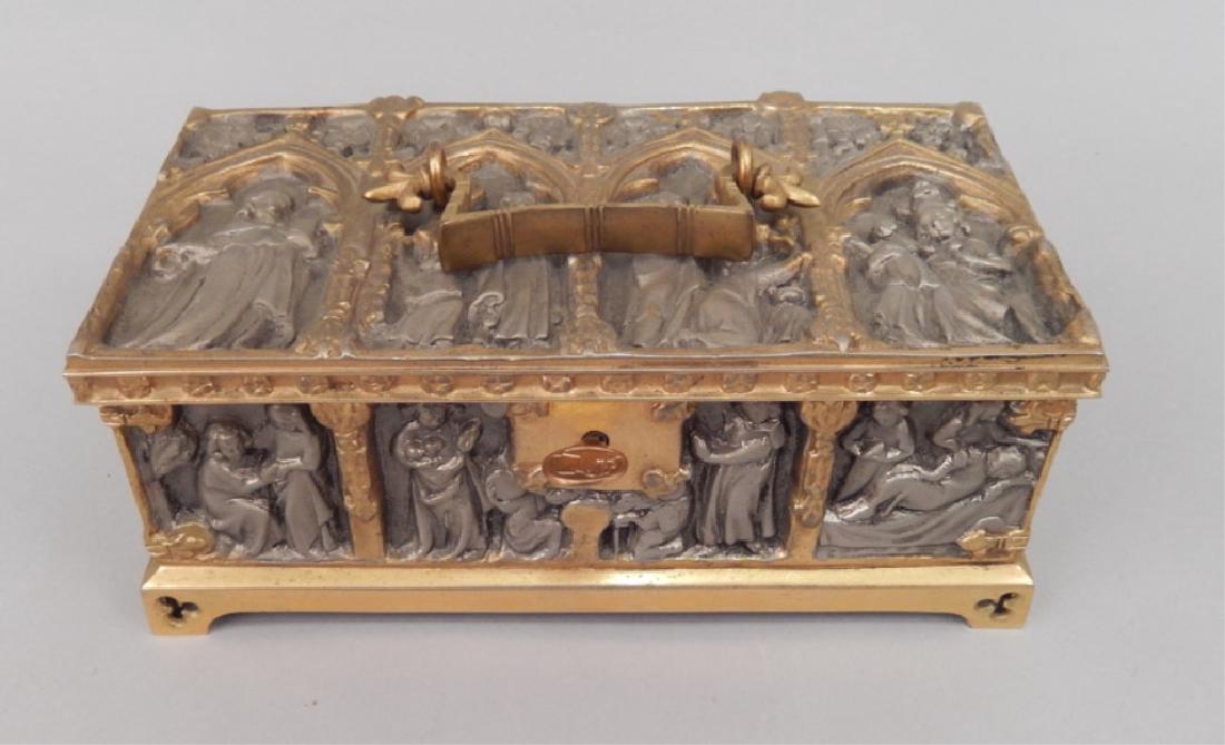 Bronze and spelter jewelry casket: Bronze and spelter jewelry casket, with handle, repousse figural design, with key, hallmarked on bottom, cloth lined interior