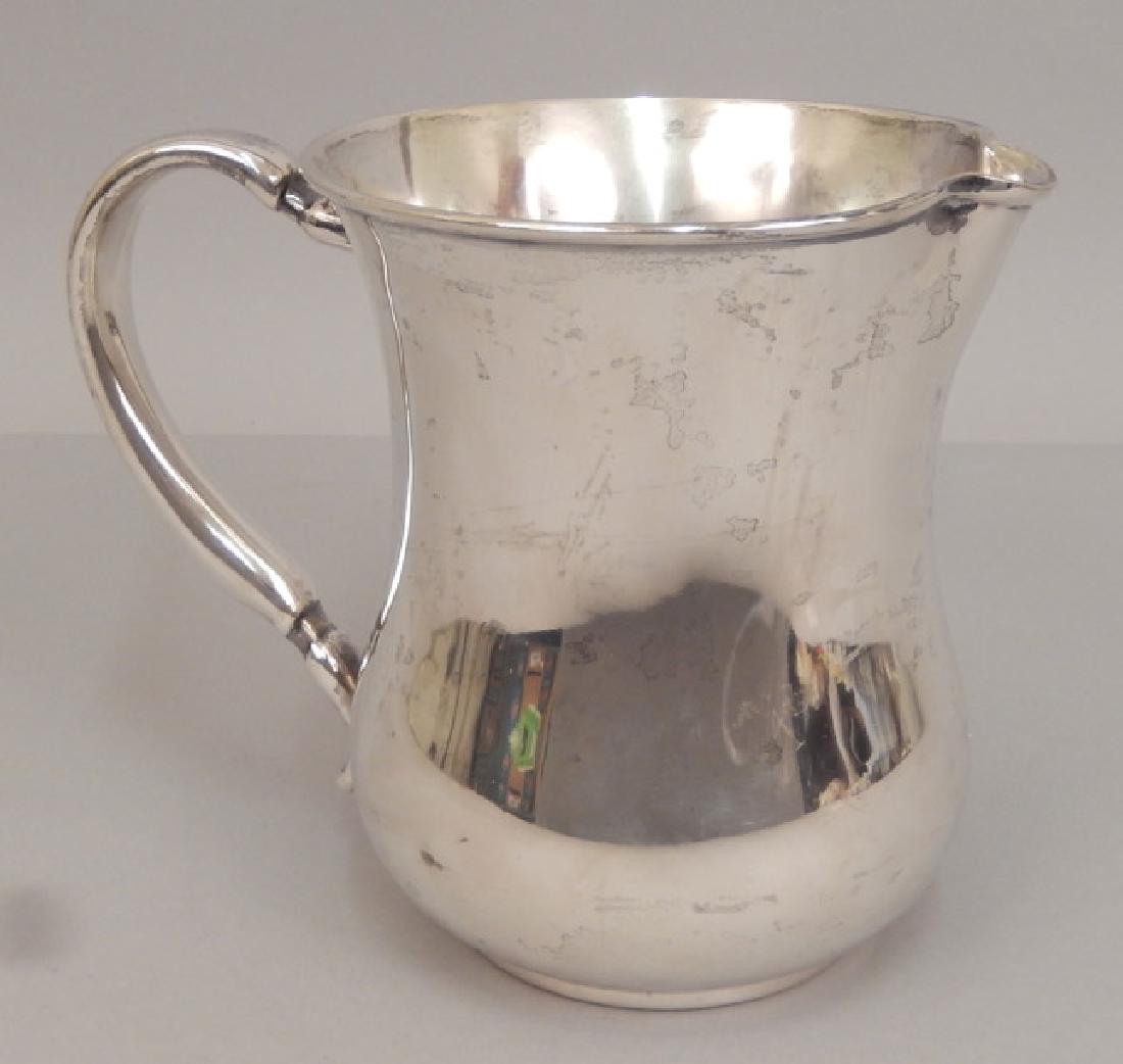 Mauser sterling silver water pitcher: Mauser sterling silver water pitcher, hallmarked on bottom "Sterling Silver 925 1000 fine, 1193, makers mark", 6" high x 7 1/2" across, 12.39 ozt.