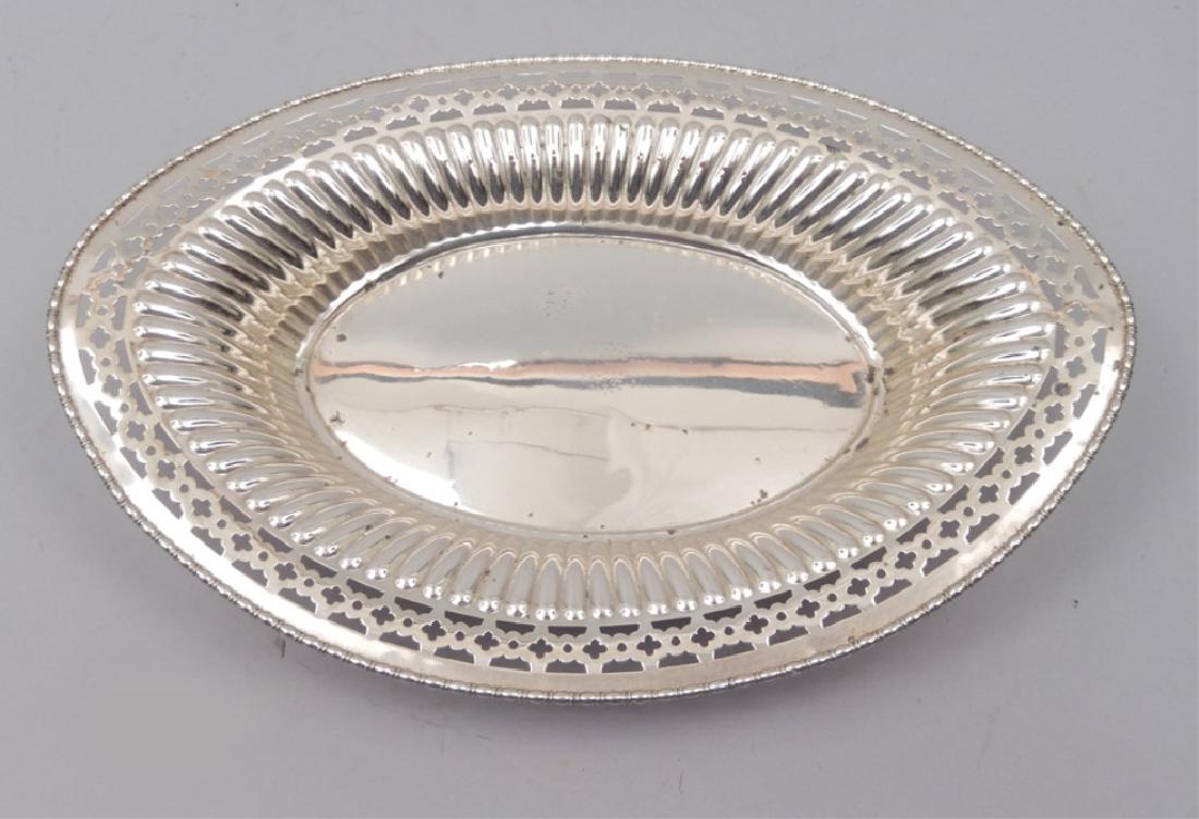 Meriden Brittania Co Theodore Starr sterling oval: Meriden Brittania Co. sterling oval pierced bread tray, hallmark on bottom, and marked 680, Theodore B. Starr New York, 1 3/4" high x 11 1/2" across, weighs 8.16 ozt.