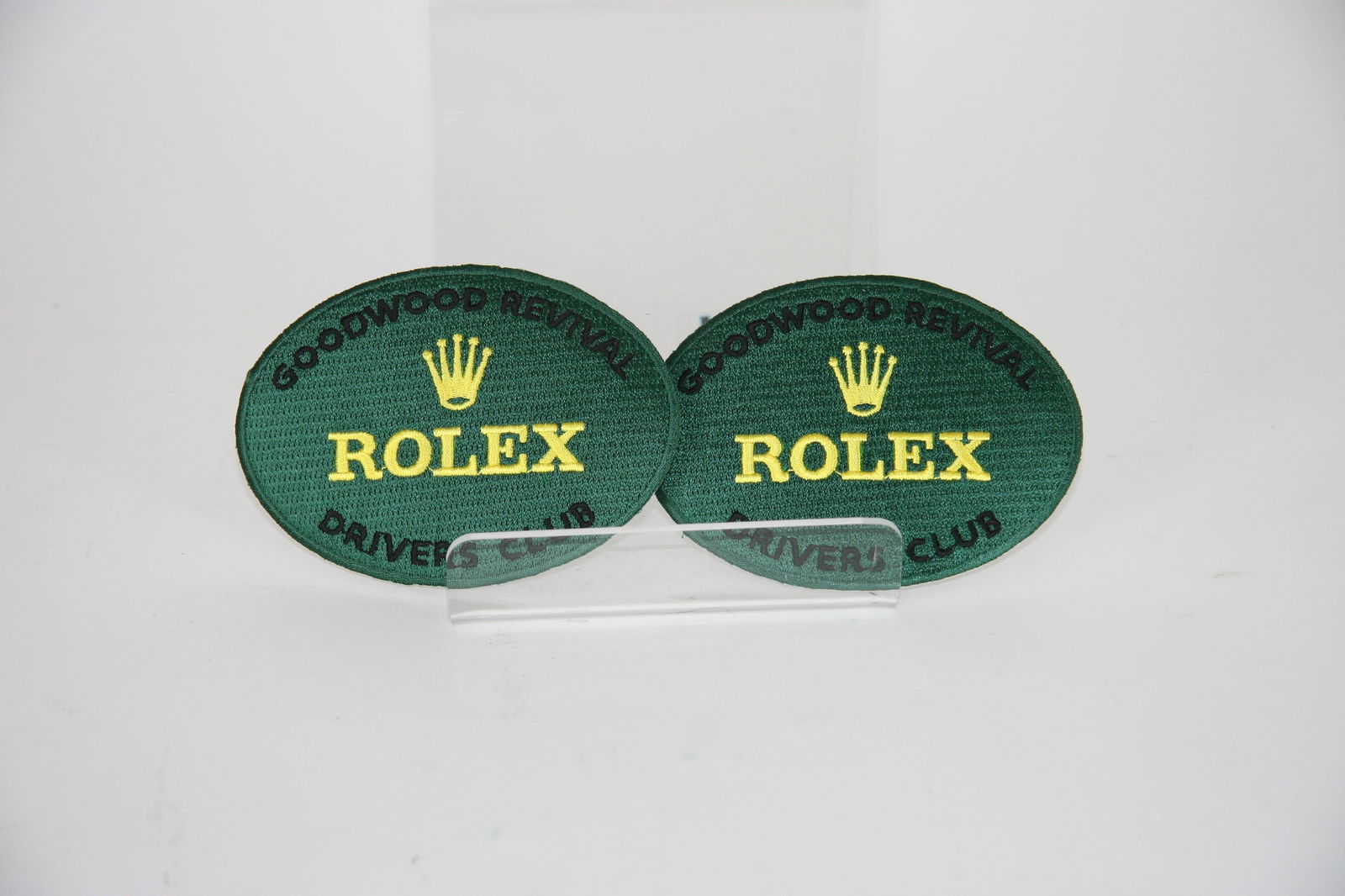 2 x official Goodwood Revival Rolex Drivers Club cloth badges: 2 x original cloth drivers club badges from Goodwood Revival owned by Desmond Smail.