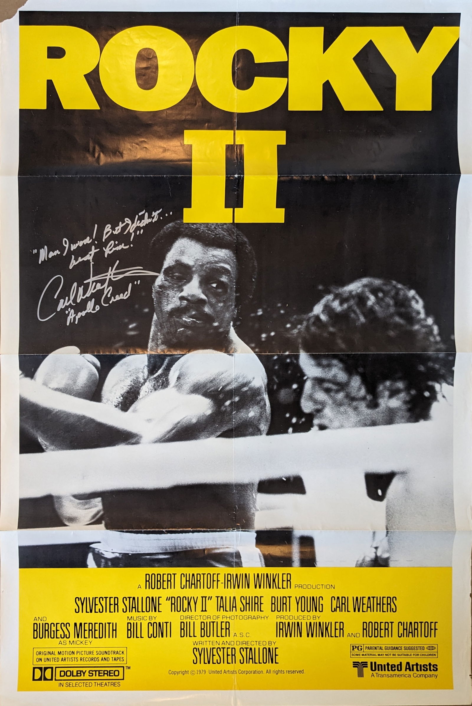 Signed “Rocky II” Original Film Poster : A “Rocky II” original theatrical release movie poster. One sheet. 27 x 41 Signed by Carl Weathers. Inscribed “Man, I won, but I didn’t beat him…Apollo Creed” Please