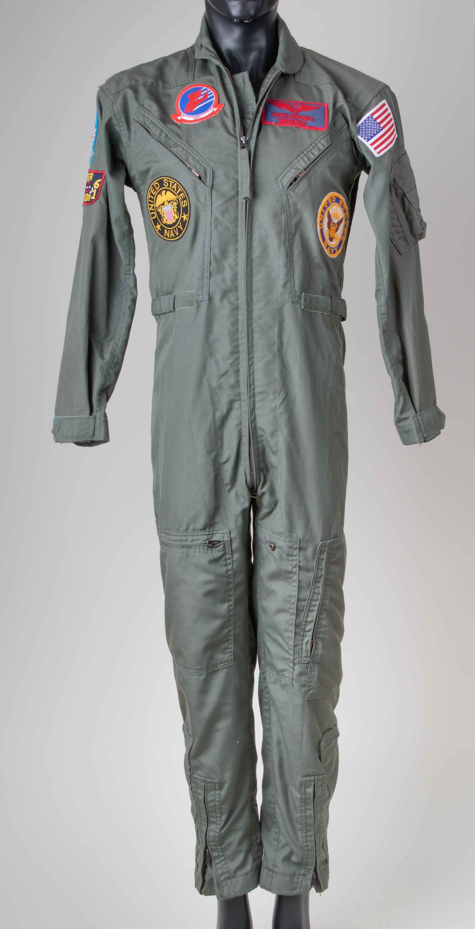 Tom Cruise Flight Suit From “Top Gun” : Pete 'Maverick' Mitchell's (Tom Cruise) flight suit from Tony Scott's action film Top Gun. Maverick wore his flight suit during aerial operations with the US Navy's Fighter Weapons School and on board