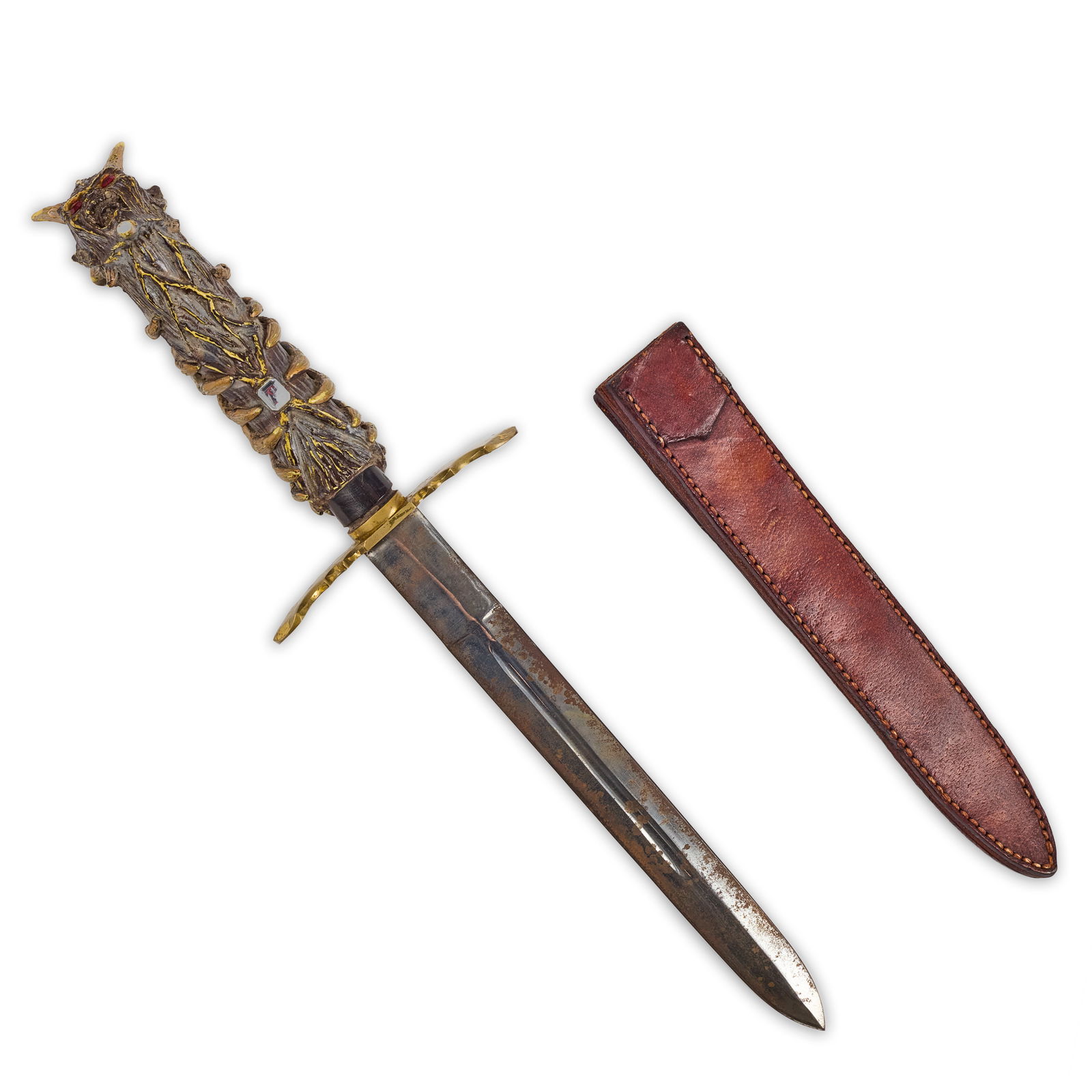 Kane Hodder Jason Voorhees Demon Dagger Prop: Production used screen matched hero dagger constructed of highly detailed resin hilt with 2-faux rubies for eyes and 1-faux diamond, brass handguard, and steel blade with sharp tip. Accompanied by a l