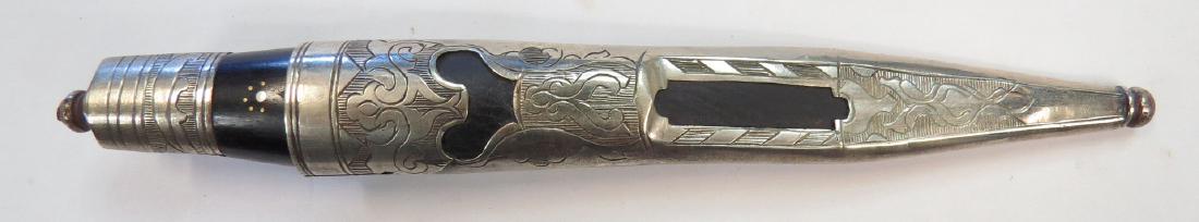 A SCANDINAVIAN SHEATH KNIFE: Likely Swedish. Mounts elaborately pierced and engraved, the hardwood grip inlaid. Mid-19th century. Overall length 19.3 cm. Condition II