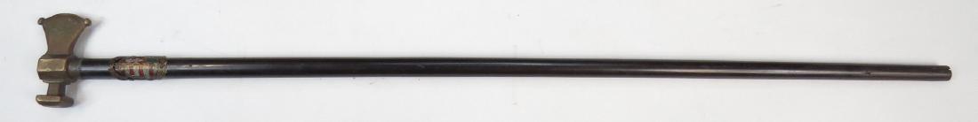 A HUNGARIAN FOKOS AXE: With finely-detailed bronze head, the characteristically long hardwood haft set with an enameled brass plaque bearing the arms of Hungary. Late 19th century. Light wear. Overall length 81.1 cm. Condit