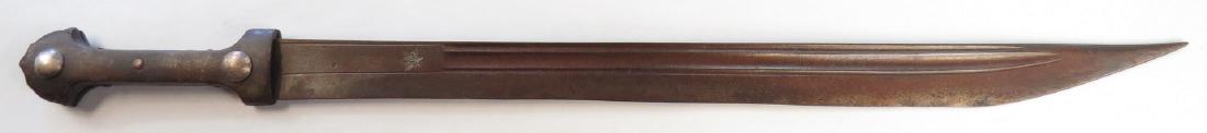 A CAUCASIAN QADDARA SWORD: A rare example of a weapon typically found in the Transcaucasus and northern Iran. With a large, well-profiled kindjal-type horn grips mounted in silver. The blade of unusual length, similar in cross-