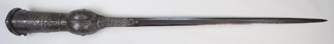 A FINE SOUTH INDIAN PATA SWORD: An exceptional example of the type, forged entirely of steel. The superbly-embossed gauntlet with chiseled foliate and geometrical panels enclosing mythological yali beasts. With chiseled steel wrist 