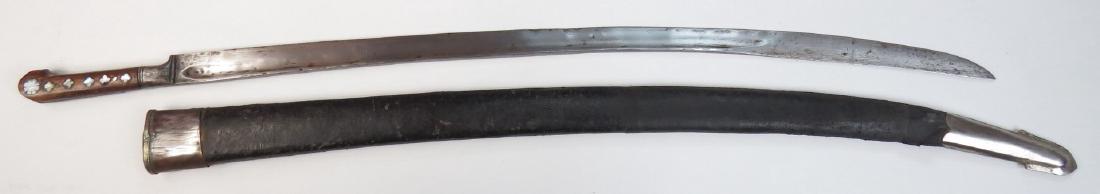 AN AFGHAN SHASHKA-TYPE SABER: A rare form, displaying design characteristics derived from both Central Asian sabers and the Cossack shashka. The hardwood grips with profiled mother of pearl inlays and steel bolster, the heavy, sin