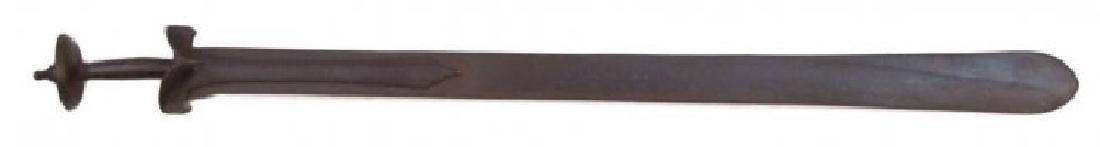 A RARE SOUTH INDIAN PATISSA SWORD: A seldom encountered and early example, robust, with well-forged characteristic Old Indian baskethilt, the long, double-edged blade with expanded tip showing traces of pattern-welded forging. 16th-17t