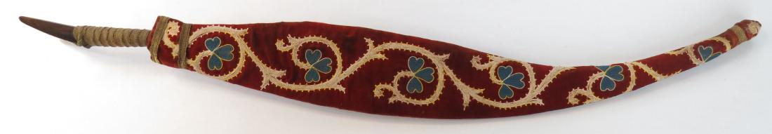A RARE BLACK SEA YATAGHAN: A scarce form found in Eastern Anatolia and the Transcaucasus, especially Armenia. The horn grips with characteristic spiked terminals, wrapped with gilt braid. The blade deeply recurved and bellied, 