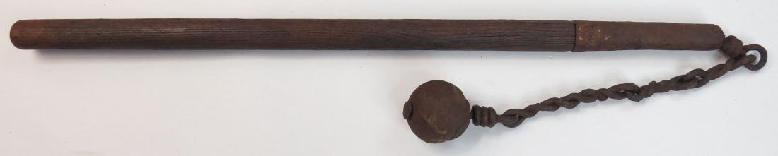 A MEDIEVAL MORNINGSTAR MACE: German or Hungarian, the heavy, spherical iron head fixed to the finely articulated handwrought chain and long ferrule. The wooden haft replaced. C. 1500. Metal parts corroded. Overall length 114cm. C