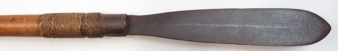 AN IGOROT SPEAR: A rare type, with well-forged steel head retained with finely-woven bands of rattan. The hardwood haft superbly balanced. Mid-late 19th century. Worn. Overall length 167.5cm. Condition IV