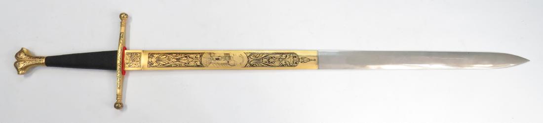 A TOLEDO MEDIEVAL-STYLE BROADSWORD: Closely based upon a noted original in the Prado Collection. The grip with silk cord wrap, the mounts elaborately engraved, enameled and heavily gilded. The long, straight, double-edged blade elaborat