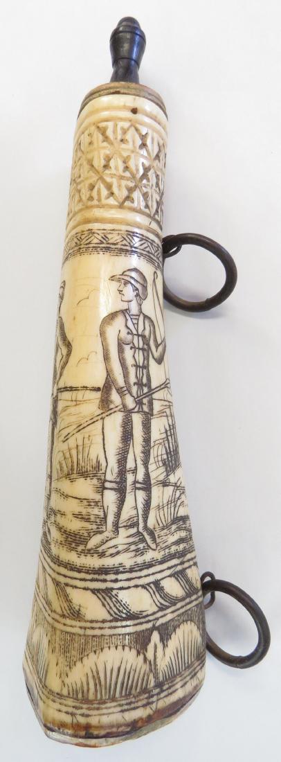 A RARE GERMAN POWDER FLASK: Crafted from a single section of bone, and elaborately carved overall with a pastoral scene involving three hunters, one with bow blowing a horn and two with boar spears, the last drinking from a flas