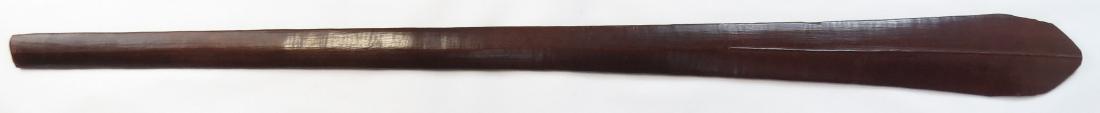 A SOLOMON ISLANDS WARCLUB: A long, heavy example carved of hardwood and expanding continuously to the ogival head, with elegant central rib. 19th c. Worn, excellent patina. Overall length 122cm. Condition III