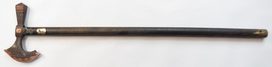A HUNGARIAN FOKOS AXE: An older example, the massive steel head well-inlaid with copper. On its hardwood haft with steel and brass mounts. 19th century. Well worn. Overall length 64cm. Condition III