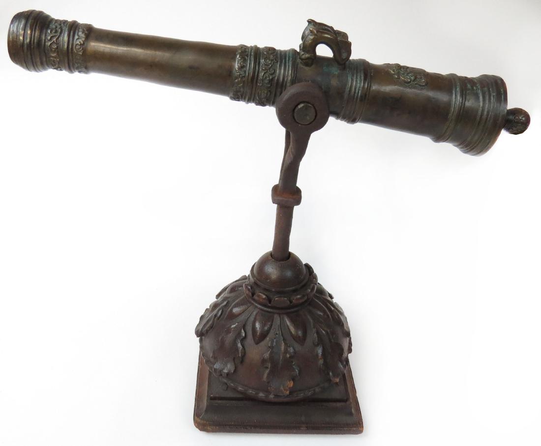 A FINE BRONZE RAIL CANNON (1 of 4)