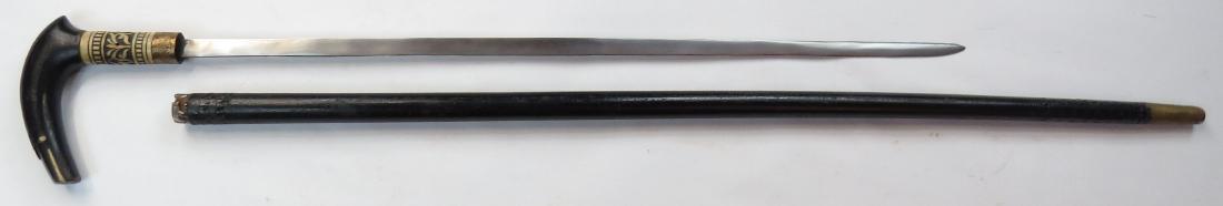 A CONTINENTAL SWORDCANE: Black-lacquered overall, with arched grip terminating in a snakehead with inlaid eyes, the ferrule of carved bone with brass ring, with a robust single-edged blade. In its fitted haft with tapered tip