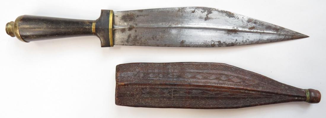 A SOMALI BILLAO DAGGER: Of characteristic form with horn grip and brass mounts, the blade handforged and double-edged. Late 19th century. Worn. Overall length 33cm. Condition III