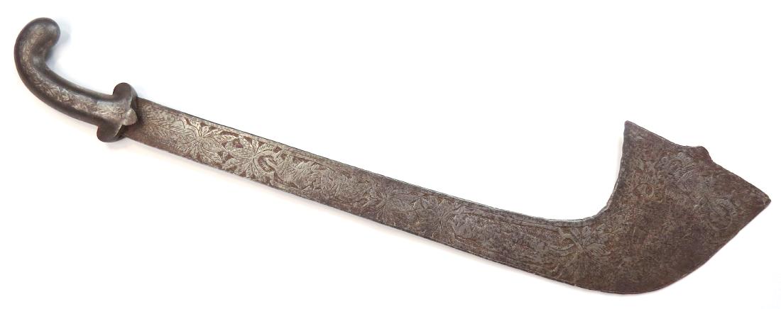 AN INDIAN KORA SWORD: A sacrificial sword, the iron hilt with rolled pommel, blade elaborately chiseled overall with floral and animal motifs. Second half of the 19th century. Worn. Overall length 66.5cm. Condition III