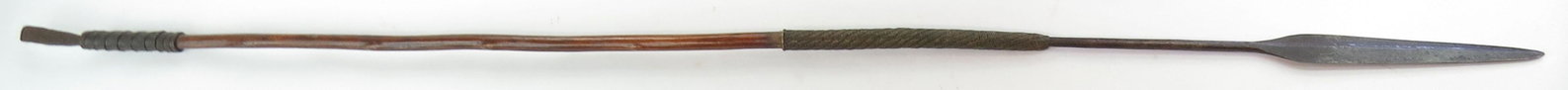 A RARE ZULU ASSEGAI SPEAR: With well-wrought head of characteristic form, on its wooden haft with elaborately wrapped wire mounts. 19th-20th century. Minor wear. Overall length 135.7cm. Condition III