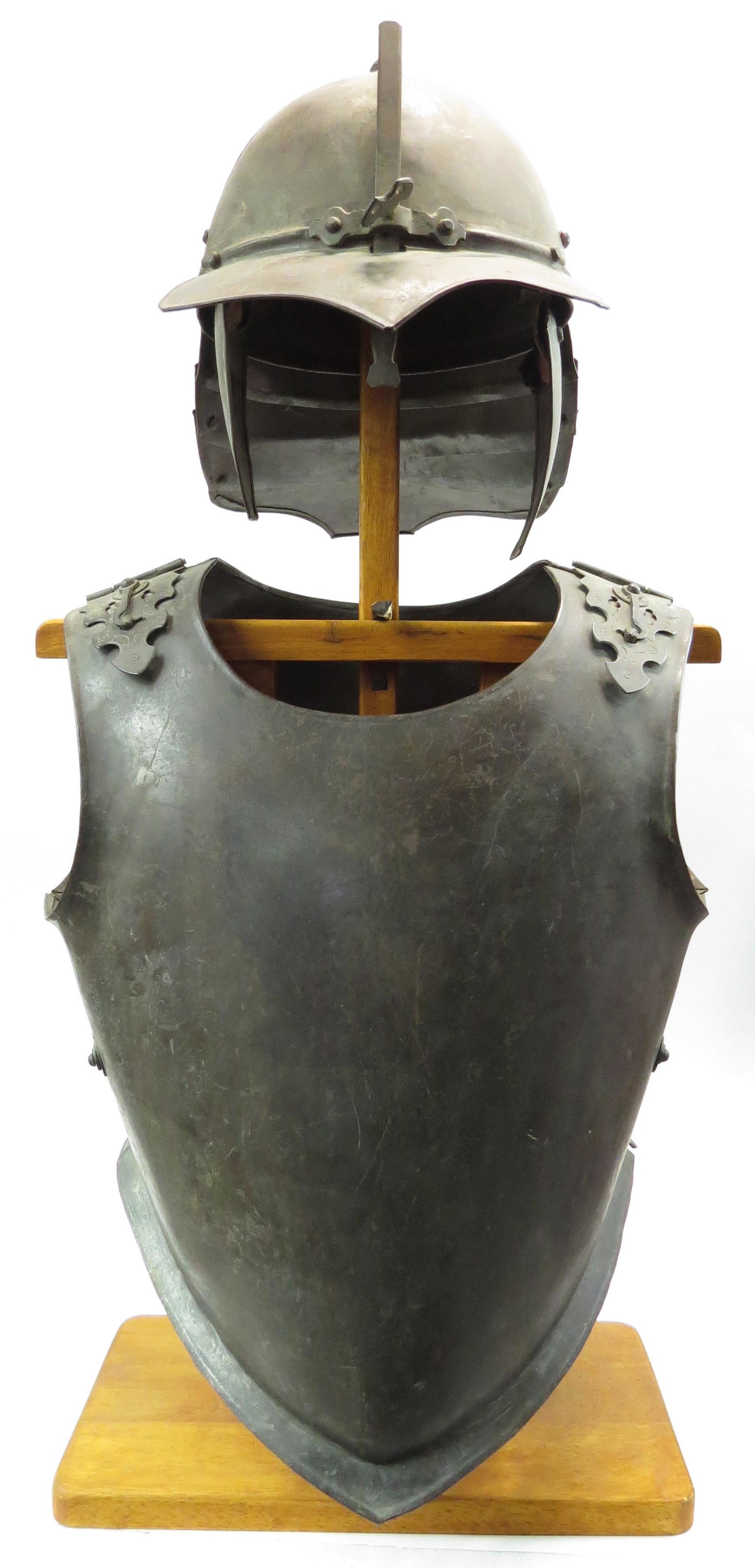 A VICTORIAN ERA ENGLISH CIVIL WAR ARMOR: Comprising a well-wrought steel lobstertail helmet with pronounced bill and adjustable nasal and breast-and backplate with profiled and engraved locking tabs at the shoulders and sides. 19th-20th cent