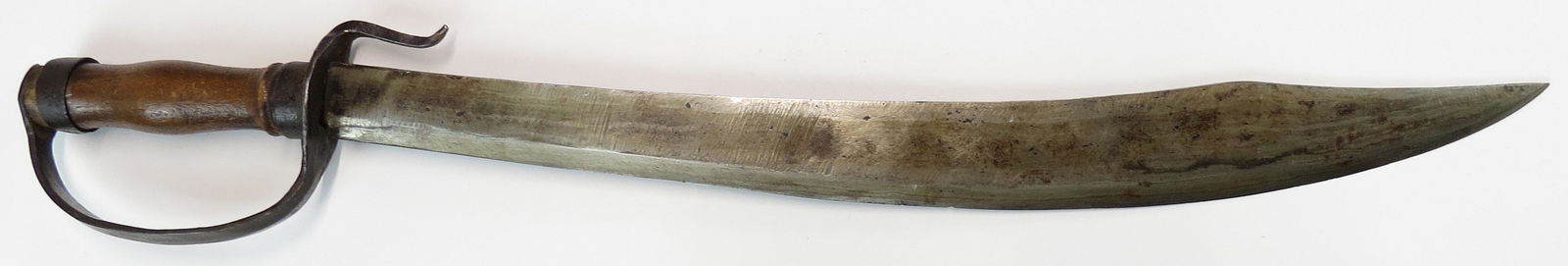 A CHINESE HUYADAO SWORD: Qing Dynasty, with wooden grip and steel guard with recurved quillon. The handforged blade of characteristic form, showing distinct layered construction, with chisel-edge and acute tip. Latter 19th ce