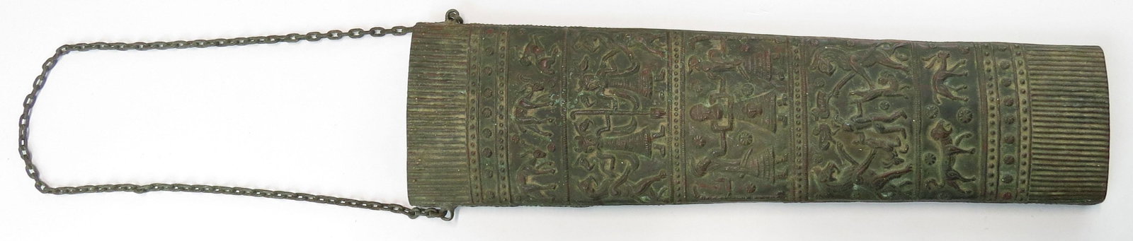 A VICTORIAN-ERA SUMERIAN BRONZE QUIVER: Of rectangular form, tapering toward to base and of flattened oval section and handwrought of bronze, with horizontal bands well embossed and chased with gods, men and beasts, the central figure holdi