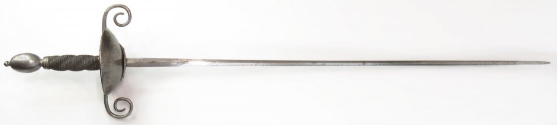 A SCANDINAVIAN CUPHILT RAPIER: ILikely Swedish, a relatively rare form with massive oval pommel and broad guard with curled quillons, the grip with original twisted wire wrap and wide, shallow cup with lozenge-shaped reinforce. The