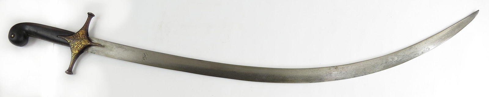 A PERSIAN SHAMSHIR SWORD: A rare example of Savafid-era work, the later ebony grips with rolled pommel, the guard and tangband of characteristic form inlaid with gold. The fine, broad blade of shallow curvature with elegant ta