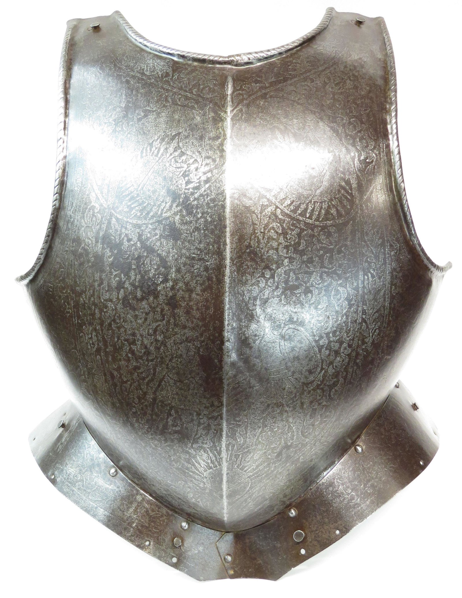 A GERMAN PARADE BREASTPLATE: Finely wrought with central ridge and rolled and roped borders, with intact fauld. The entire surface etched in Mannerist motifs involving gryphons, stands of arms, a saint and a knight, all amongst t