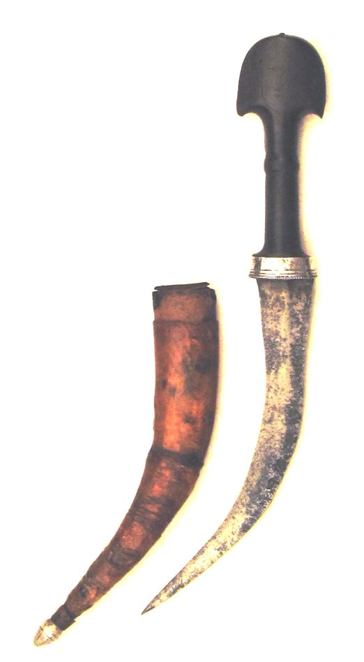 A Marsh Arab Khanjar Dagger: Horn grip of characteristic form with a man's face carved in, and curved, double-edged blade. With its leather covered wooden scabbard. Mid 19th century. Wear to scabbard. Overall length 38.5 cm, blad