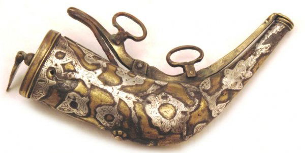 A Central Asian Priming Flask: A brass priming flask of characteristic form, probably Uzbek. Overlaid with engraved silver plaques. Mid- 19th century. Considerable losses to body on reverse. Length 15.7 cm. Condition IV