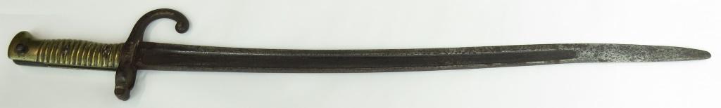 A FRENCH M 1866 CHASSEPOT BAYONET: With brass hilt and recurved blade. 19th century. Well worn overall. Overall length 68.5cm. Condition IV