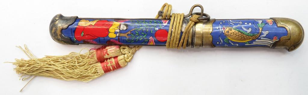 A KOREAN EUNJANGDO DAGGER: Traditionally carried by aristocratic women for personal protection. With silvered brass mounts, the grip and sheath superbly enameled with a lady in a garden, trees a bird and flowering vines. The st