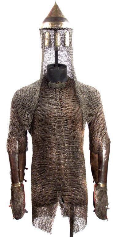 THE ARMOR OF SAHIB GIRAY II, KHAN OF CRIMEA: Comprising the helmet, coat of mail, gauntlets and armguards of Sahib II Giray, Khan of Crimea (r. 1771-1775 c.e.) The exceptionally long mail coif (54 cm from brow to end) is forged of rings of flatt