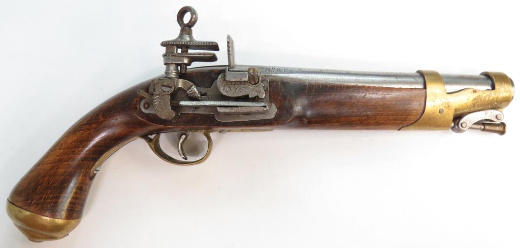A REPLICA SPANISH MIQUELET PISTOL: A fine copy with functioning miquelet lock and brass-mounted wooden stock. Barrel with numerous marks. First half of the 20th century. Minor wear. Overall length 36cm. Condition III